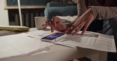 Cropped accountant using calculator app Stock Footage 182072740