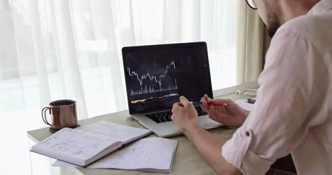A cropped bearded analyst is nervous looking at the falling trading chart Stock Footage 162180452