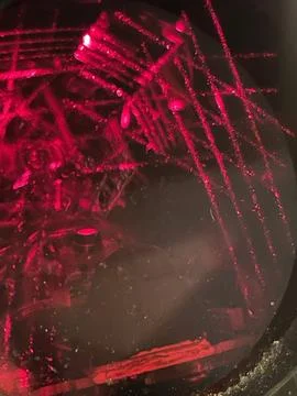 Cropped close up of red light glowing in barcode scanner Stock Photos