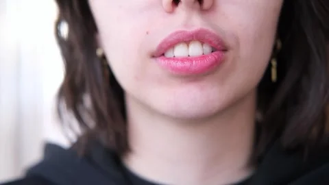Cropped close-up view lower part face of young brunette woman, smiling Stock Footage 261061045