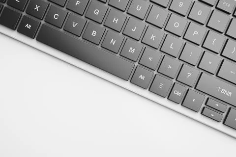 Cropped computer keyboard on the table. Stock Photos