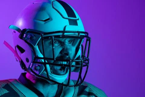 Cropped cside view image of professional american footblall player in protective Foto stock