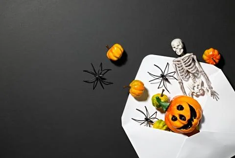 Cropped Halloween envelope with skeleton jack-o-lantern, pumpkins and spide.. Stock Photos