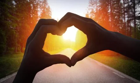 Cropped Hand Making Heart Shape Stock Photos