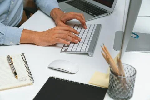 Cropped hands IT developer working online software information on pc. Pecuniary. 스톡 사진