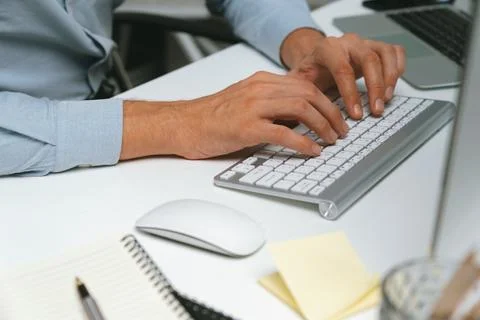 Cropped hands IT developer working online software information on pc. Pecuniary. Stock Photos