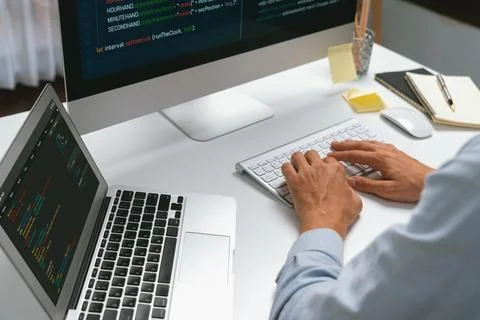 Cropped hands IT developer working online software information on pc. Pecuniary. Stockfoto's