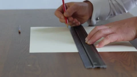 Cropped image of architect working with construction plans. Designer sketching Stock Footage 143165280