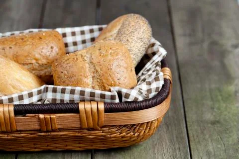 Cropped image of assorted bread in basket Stock Photos