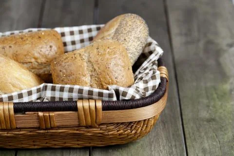 Cropped image of assorted bread in basket Stock Photos