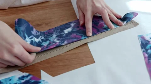 Cropped image of beautiful young designer working with sketches and measure tape Stock Footage 269802981