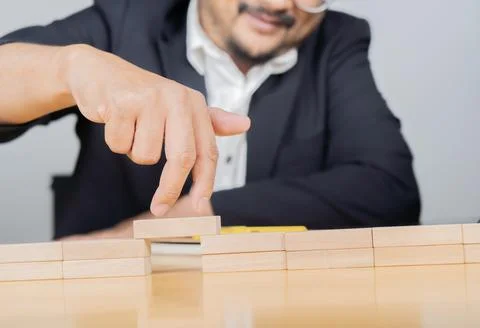 Cropped image of businesspeople solving problems by building bridges with w.. Stock Photos