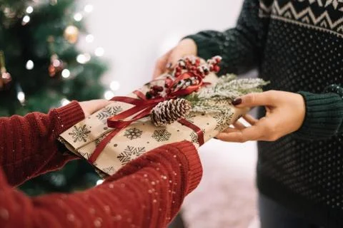 Cropped image of gift exchange between woman and kid Stock Photos
