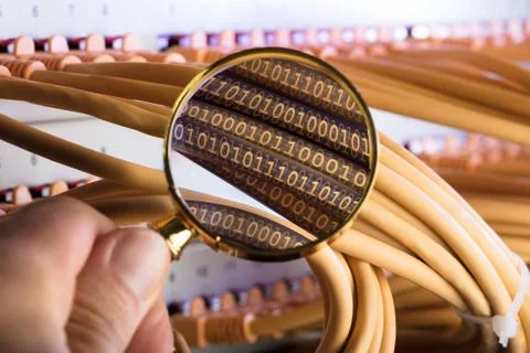 Cropped image of hand examining binary codes over cables in server room Stock Photos