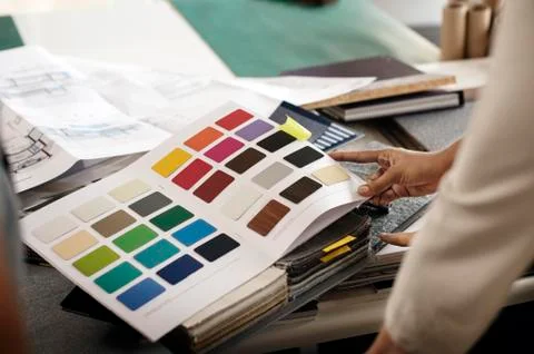 Cropped image of interior designer examining color swatches at office Stock Photos