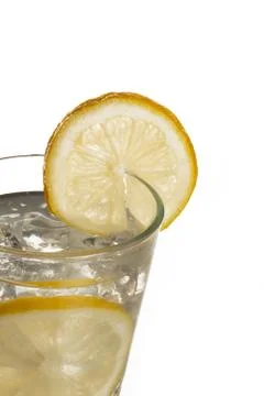 Cropped image of lime juice with slice Stock Photos