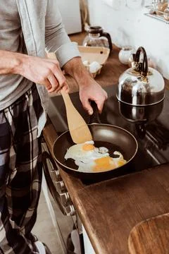 Cropped image man cooking scrambled Stock Photos