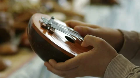 Cropped image of  man playing on a mbira. Stock Footage 49669746