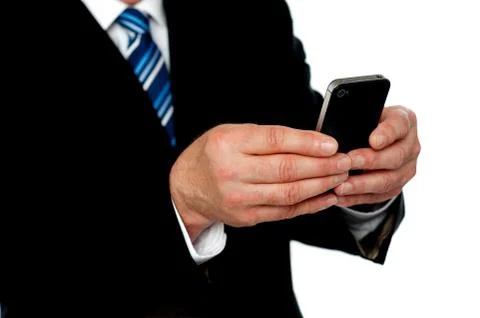 Cropped image of a man sending message Stock Photos