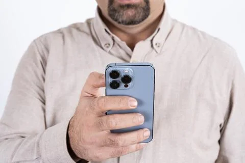 Cropped image of man using, holding modern smartphone. Stock Photos