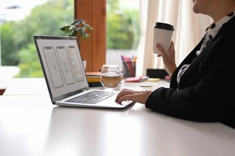 Cropped image professional web developer working with prototype wireframe for 库存照片