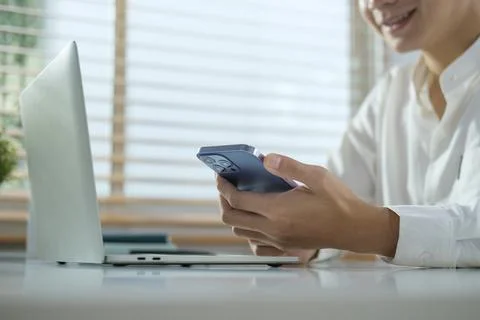 Cropped image of smiling man messaging in social media or communicating onl.. Stock Photos