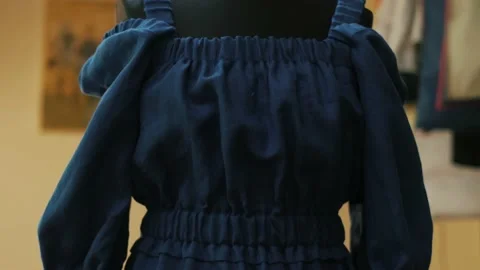 Cropped image of tailor putting pin into dress on mannequin 스톡 동영상 153814776
