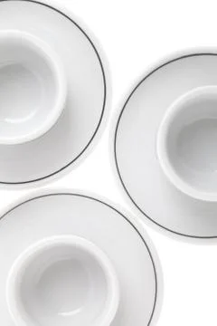 Cropped image of teacups on white Stock-Fotos