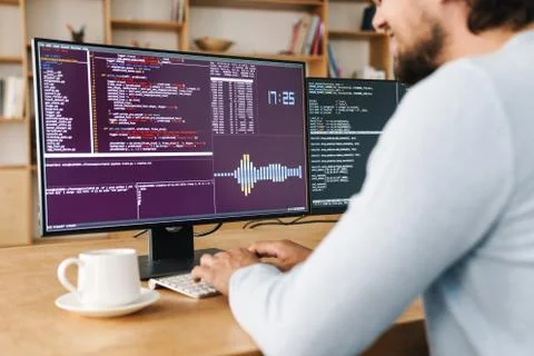 Cropped image of unshaven programmer man working with computers Stock Photos