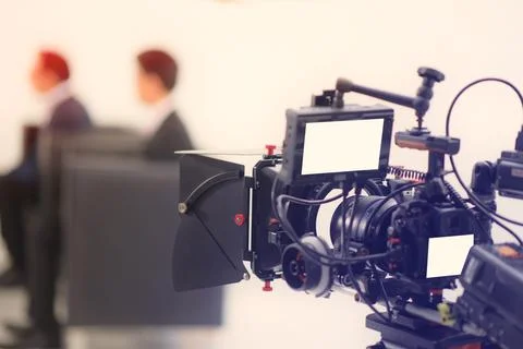 Cropped image of a Video of the interview. Television equipment, camcorder wi Stock Photos