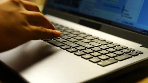 Cropped image of a young man working on his laptop in a coffee shop Stock Footage 63997498