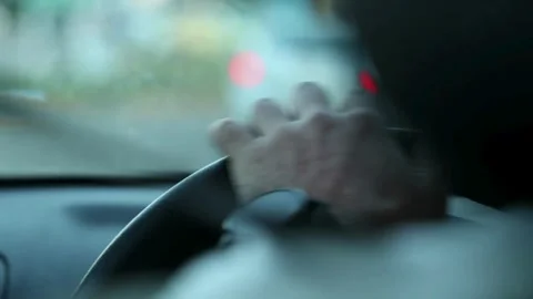 Cropped of man driving car, over shoulder shot. hands on steering wheel inside Stock-Footage 336265295