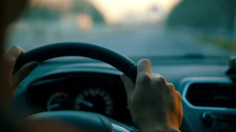 Cropped of man driving car, over shoulder shot. hands on steering wheel inside Stock-Footage 336265462