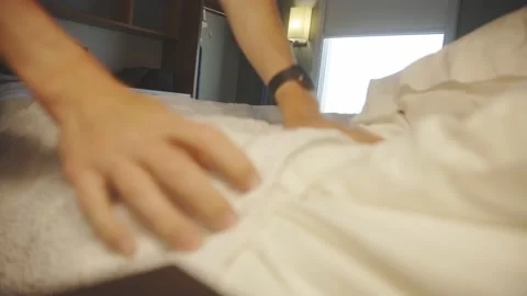 Cropped Person Arranging Bedsheets Of A Room. Selective Focus Shot 스톡 동영상 217915533