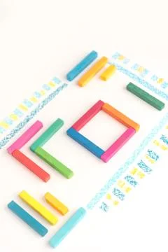 Cropped photo of a cute geometric pattern made of colorful kid's pastel chalk Stock Photos