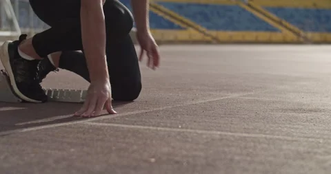 Cropped runner preparing for race Stock Footage 199649559