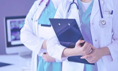 Cropped shoot of two young doctors female with stethoscope. Stock Photos
