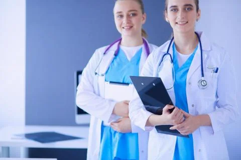 Cropped shoot of two young doctors female with stethoscope. Stock Photos