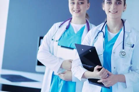 Cropped shoot of two young doctors female with stethoscope. Stock Photos