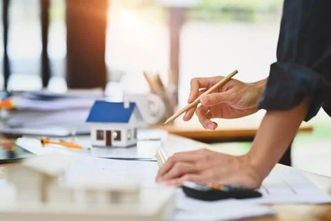 Cropped shot of architect man working with blueprints at workstation Foto stock