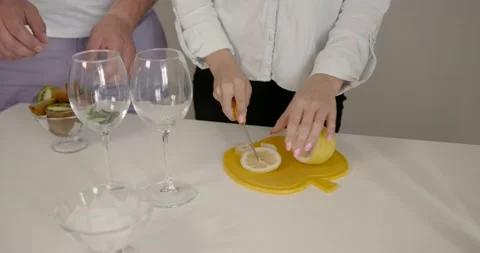 Cropped shot of couple preparing lemonade in the kitchen Stock Footage 168786907