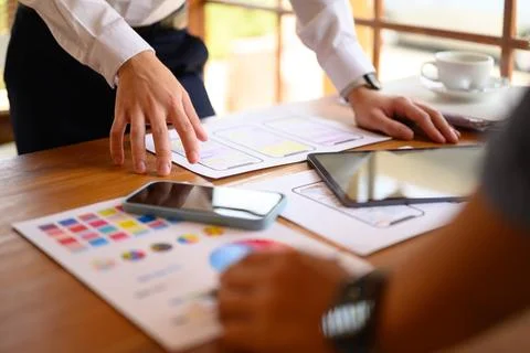 Cropped shot developers team working on new website wireframe at office Stock Photos