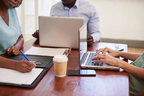 Cropped shot of doctors hands using technology during medical admin meeting Stock Photos