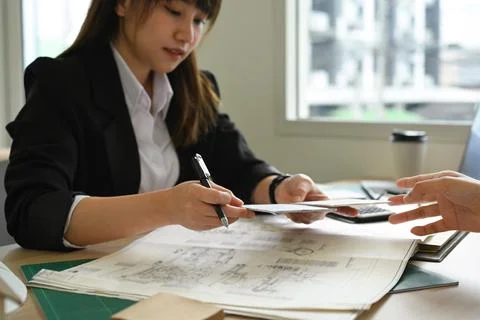Cropped shot of engineer or architect team brainstorming, planning development Stock Photos