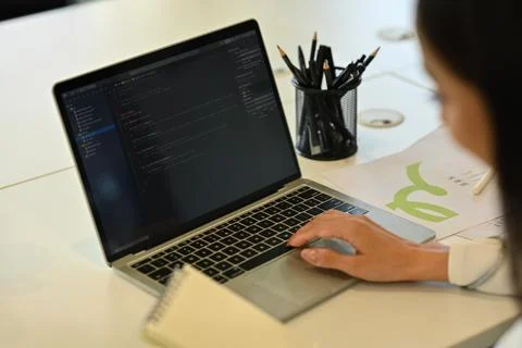 Cropped shot of female developer working with coded data on computer screen at Stockfoto's