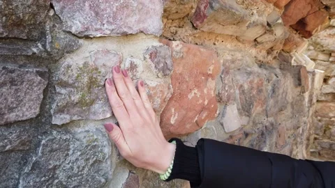 Cropped shot of human hand touching stone wall. Stock Footage 133791116