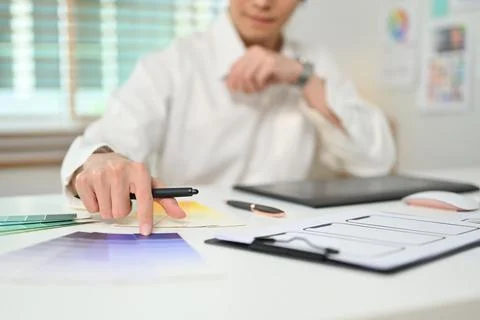 Cropped shot of male web developer reviewing sketched wireframe layout design 스톡 사진