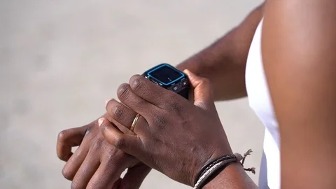 Cropped shot of man checking watch outdoors Stock Footage 105006547