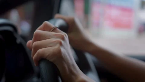 Cropped shot of man with his hands on steering wheel, driving his car. Stock-Footage 336268048