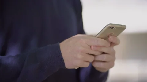 Cropped shot of man using cell phone 動画素材 107133266